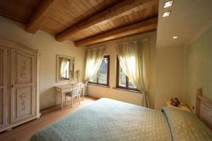 Postel nebo postele na pokoji v ubytování Agriturismo I Leprotti
