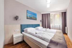 Posteľ alebo postele v izbe v ubytovaní Apartamenty Cypel Helski