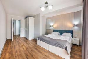 Posteľ alebo postele v izbe v ubytovaní Apartamenty Cypel Helski