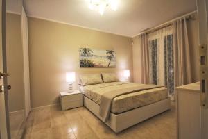 Ein Bett oder Betten in einem Zimmer der Unterkunft Porto San Rocco Italy Rental