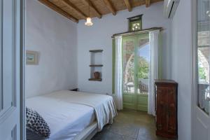 Posteľ alebo postele v izbe v ubytovaní Elayio Houses