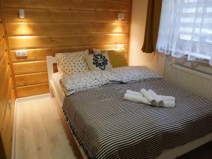 Postel nebo postele na pokoji v ubytování Apartamenty Milka
