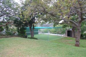 a tennis court in the middle of a yard at Back-Up Power with Stable WiFi! Central in Walmer in Port Elizabeth