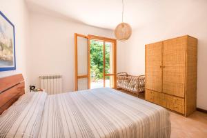 Calarossa Seaview by Wonderful Italy tesisinde bir odada yatak veya yataklar
