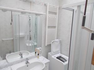 a white bathroom with a sink and a shower at Casa Iglesias in Cavallino-Treporti +12 photos