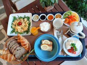 a tray of food with different types of food at Daphne's Club Hotel Apartments in Xylokastro