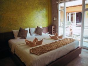 Postel nebo postele na pokoji v ubytování Silver Sands Resort - Koh Tao