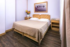 Postel nebo postele na pokoji v ubytování Albergo Italia