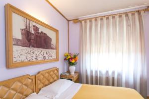 Postel nebo postele na pokoji v ubytování Albergo Italia