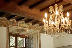 a chandelier hanging from a ceiling in a room at Villa Vistarenni in Gaiole in Chianti