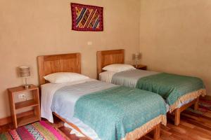 A bed or beds in a room at MAMA COYA