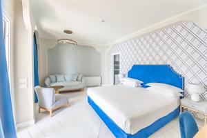 Postel nebo postele na pokoji v ubytování Hotel Club Due Torri
