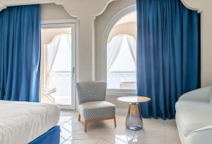 Postel nebo postele na pokoji v ubytování Hotel Club Due Torri