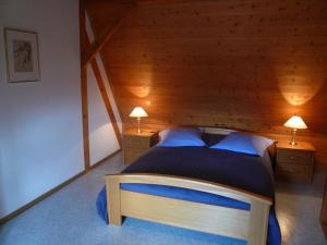 Postel nebo postele na pokoji v ubytování A l'Ancien Moulin