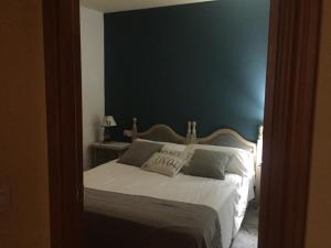 Cama o camas de una habitación en La Fusteria del Casat