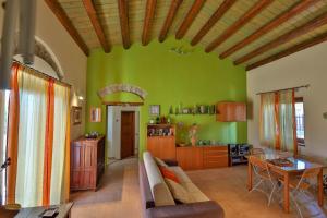 a living room with a couch and a table at Madonie Park Gates - Casa in C.Da Donalegge in Castellana Sicula
