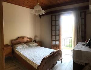 Postel nebo postele na pokoji v ubytování Dimitris House