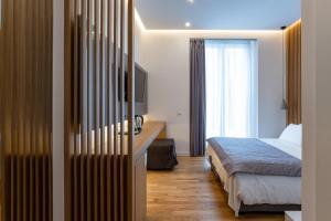 Postel nebo postele na pokoji v ubytování Concept Terrace Hotel