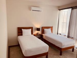 Postel nebo postele na pokoji v ubytování Hotel Muyu Tulum