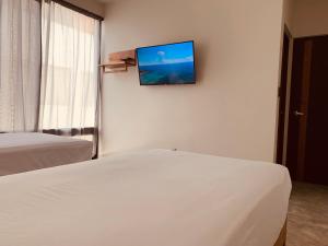 TV a/nebo společenská místnost v ubytování Hotel Muyu Tulum