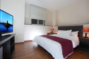 Postel nebo postele na pokoji v ubytování King Town Hotel