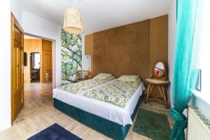 Postel nebo postele na pokoji v ubytování Willa Onyks Apartamenty