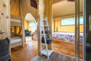 A bunk bed or bunk beds in a room at Kidwelly Glamping