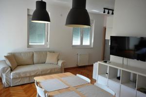 TV a/nebo společenská místnost v ubytování Apartment Exclusive