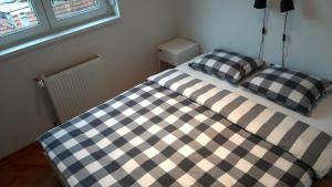 Postel nebo postele na pokoji v ubytování Apartment Exclusive