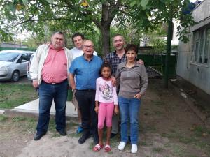 a group of people posing for a picture under a tree at Victoria in Bagdatʼi