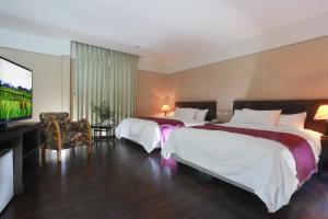 Postel nebo postele na pokoji v ubytování King Town Hotel