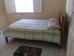Cama ou camas em um quarto em Casa espaçosa- Camboinha