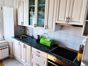 Kuchyň nebo kuchyňský kout v ubytování Apartment Riva