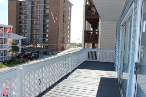 a balcony of a house with a view of a street at Blue Haven Apartments in Ocean City