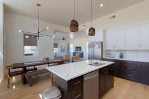 a kitchen with a sink and a table in it at Villa #8 in St. George