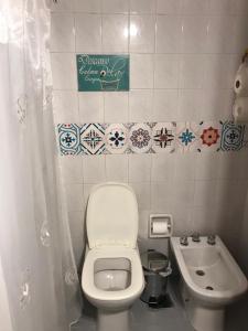 a small bathroom with a toilet and a sink at apart Italia in Río Cuarto