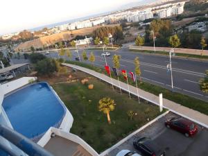 arial view of a road and a parking lot with a swimming pool at Appart-Hotel Cabo Dream in Cabo Negro