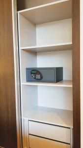 a shelf that has a radio on top of it at Porto City Hotel in Porto