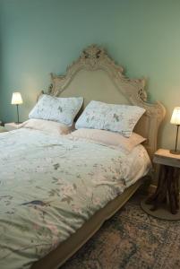 a bed in a bedroom with two pillows on it at The Broken Dish - Full Cottage Apartment in Mendham