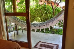 Um jardim em Club do Balanço Pousada e Restaurante