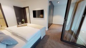 Postel nebo postele na pokoji v ubytování White Pearl Apartment 0.05