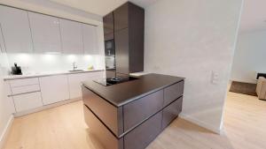 Kuchyň nebo kuchyňský kout v ubytování White Pearl Apartment 0.05 + 28 fotografií