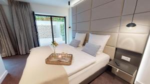 Postel nebo postele na pokoji v ubytování White Pearl Apartment 0.05