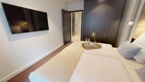 Postel nebo postele na pokoji v ubytování White Pearl Apartment 0.05