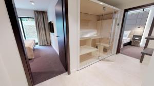 Postel nebo postele na pokoji v ubytování White Pearl Apartment 0.05