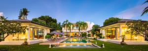 a house with a swimming pool in the yard at Baan Asan in Taling Ngam Beach