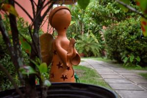 Um jardim em Club do Balanço Pousada e Restaurante