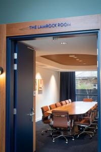 a conference room with a table and chairs at Byng Street Boutique Hotel in Orange