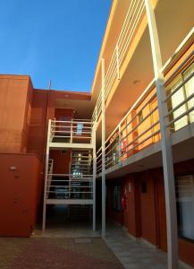 a building with a staircase on the side of it at Hotel Doña Esperanza in Calama