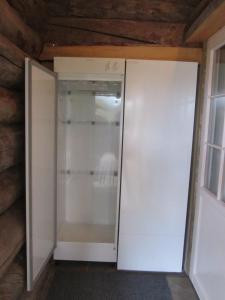 a white closet with a door in a room at Rukakaiku Cottages in Ruka +52 photos